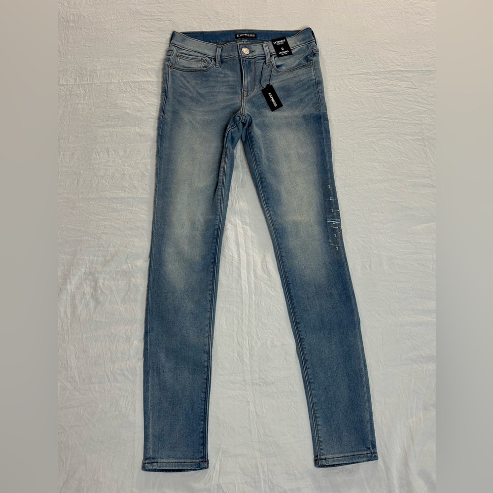 EXPRESS ULTIMATE STRETCH LEGGING MID RISE.Blue jeans.